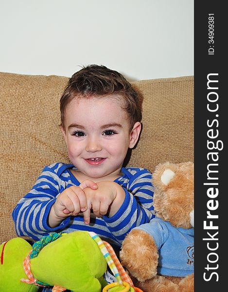 A portrait of a happy baby boy playing with toys. A portrait of a happy baby boy playing with toys.