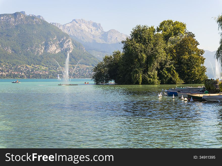 The Annecy lake and fountain in Annecy town . France. The Annecy lake and fountain in Annecy town . France