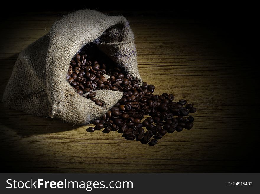 Spill Robusta Coffee Beans on Goni Sack