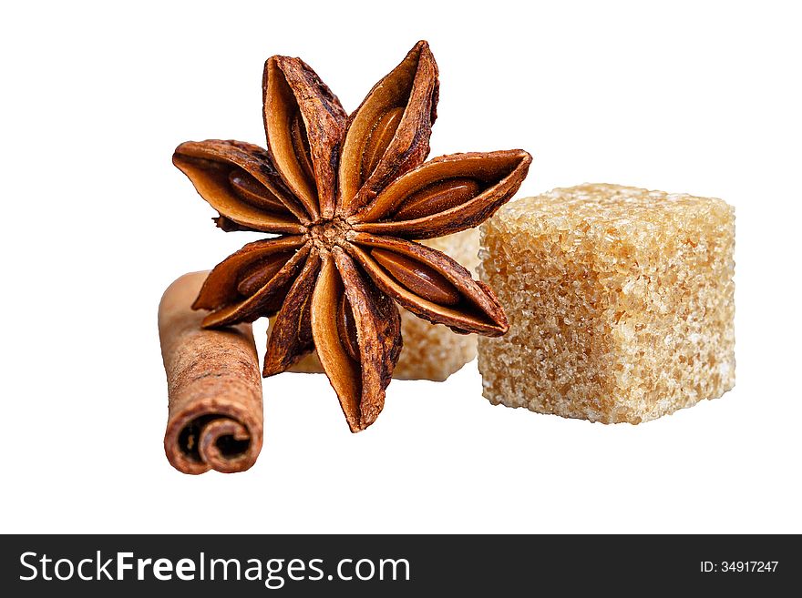 Still life of cinnamon, star anise and sugar cubes isolated on white background. Still life of cinnamon, star anise and sugar cubes isolated on white background