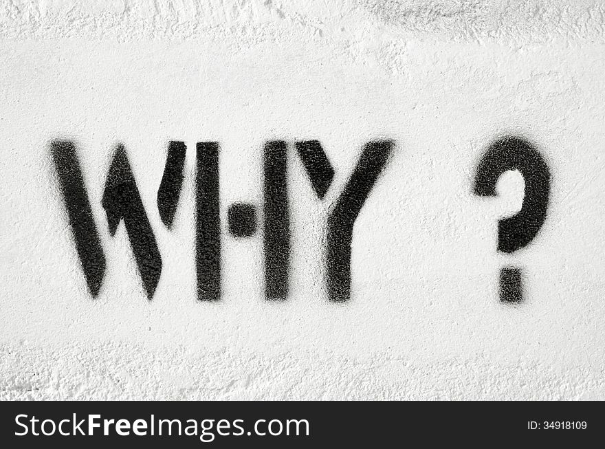 Why questions textured stencil print on the white brick wall
