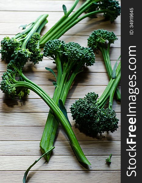 Green sprouting broccoli on wooden background. Green sprouting broccoli on wooden background