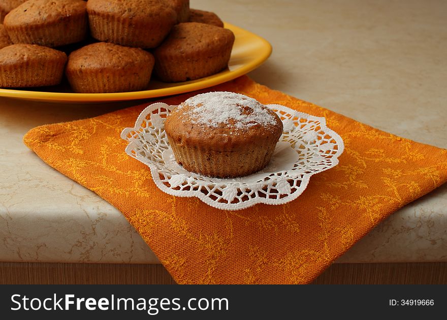 Homemade cake dusted with icing sugar and put on a plate with lace cloth. Homemade cake dusted with icing sugar and put on a plate with lace cloth