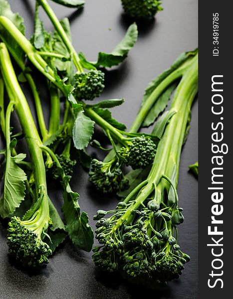 Sprouting broccoli variety on black glossy background