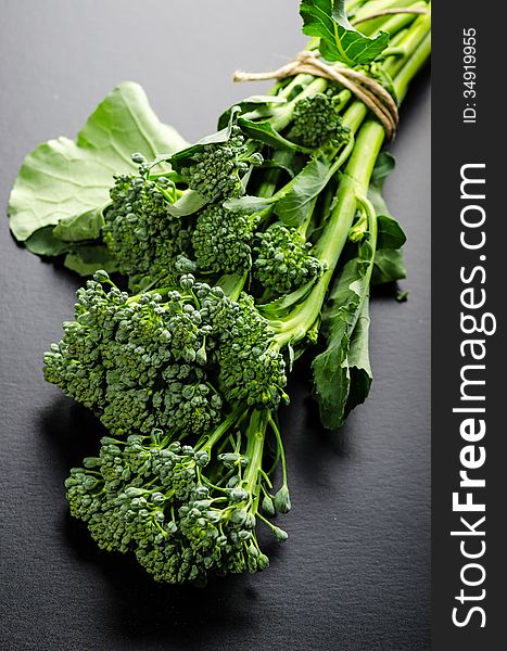Sprouting variety broccoli bouquet on black background. Sprouting variety broccoli bouquet on black background