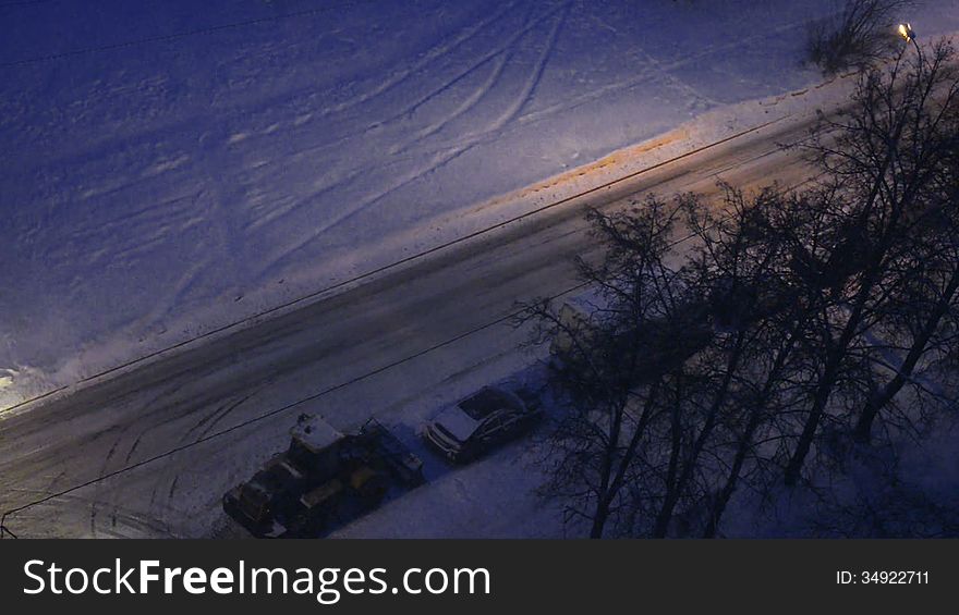 Town winter night, snowy road