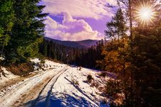 Snowy Road To Coniferous Forest In Mountains Royalty Free Stock Photography Snowy Road To Coniferous Forest In Mountains Royalty Free Stock Photography