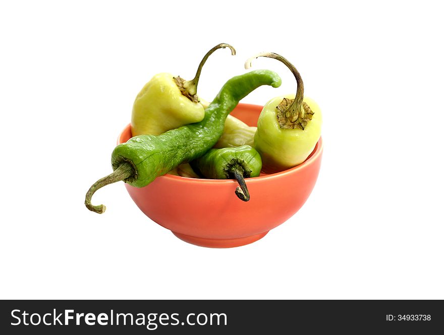 Isolated on white hot peppers in a bowl