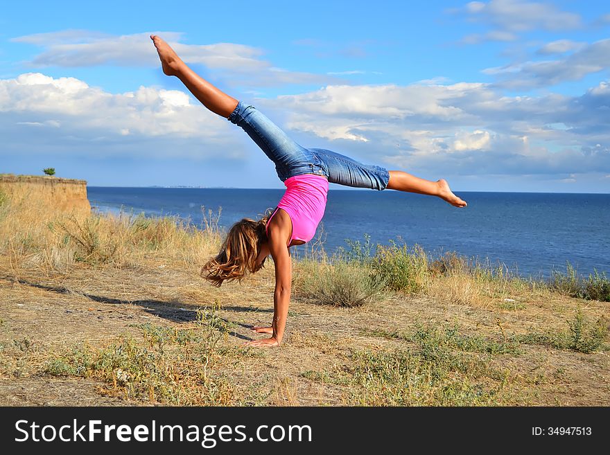 Dancer exercising near the sea