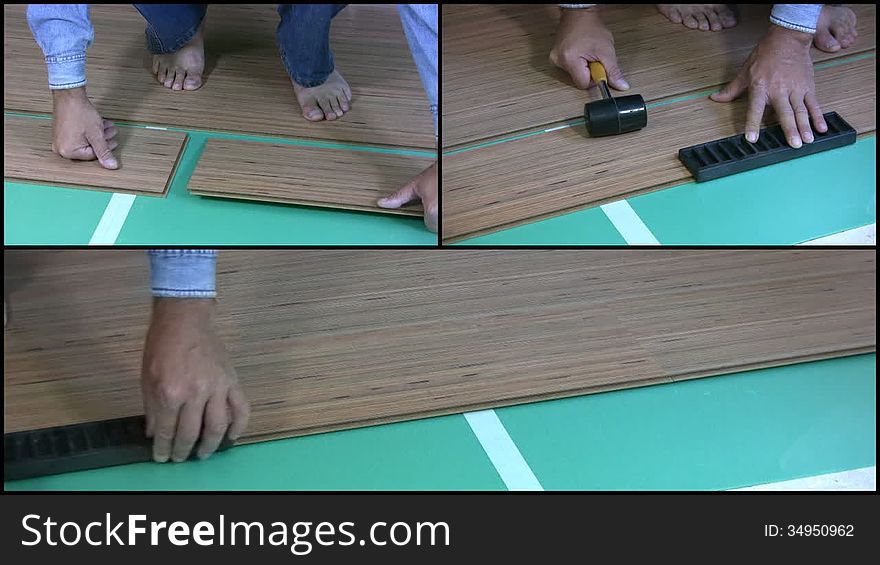 Men barefoot in blue jeans and blue denim shirt, puts on the floor of the room laminate. Close-up. Visible legs, hands and tools. Men barefoot in blue jeans and blue denim shirt, puts on the floor of the room laminate. Close-up. Visible legs, hands and tools
