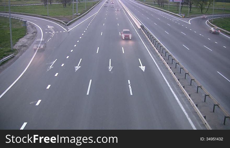 Traffic on the highway evening. Time-Laps. Rapid approach of night. Motion blur. Traffic on the highway evening. Time-Laps. Rapid approach of night. Motion blur