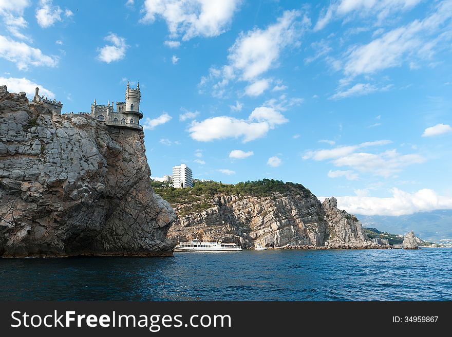 Medieval knight's castle on a high cliff by the sea. Medieval knight's castle on a high cliff by the sea