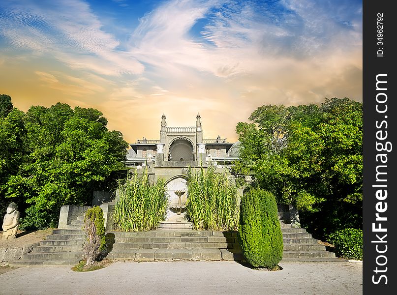 Stairs and palace in beautiful green garden