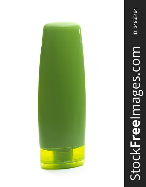 Green plastic cosmetic bottle isolated on white background. Green plastic cosmetic bottle isolated on white background