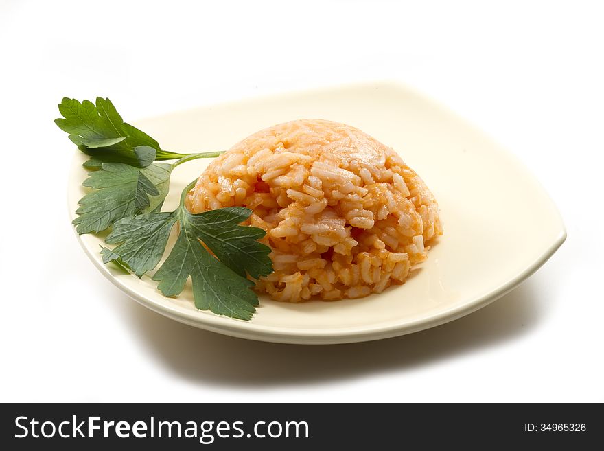 Clump of red risotto on plate isolated on white background