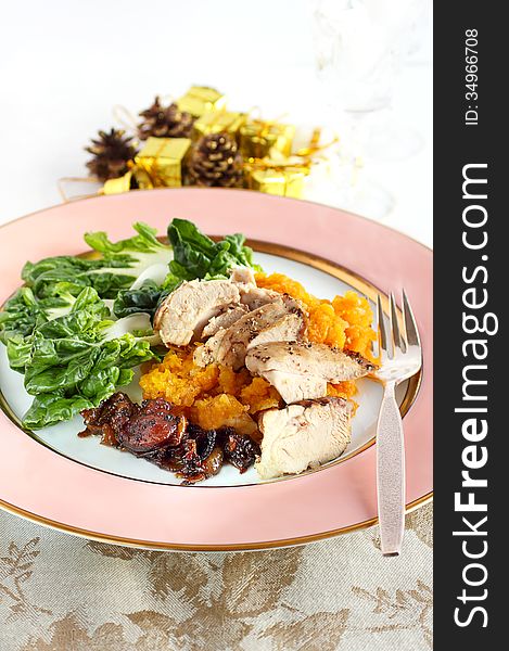 Herb chicken served with mashed squash, Chinese cabbage and caramelized onions, a healthy alternative for Christmas, Thanksgiving or Hanukkah. Herb chicken served with mashed squash, Chinese cabbage and caramelized onions, a healthy alternative for Christmas, Thanksgiving or Hanukkah