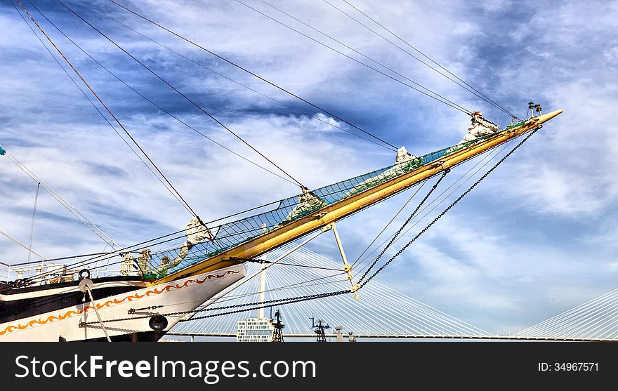 Big sailing vessel against the blue sky in the bright sunny day