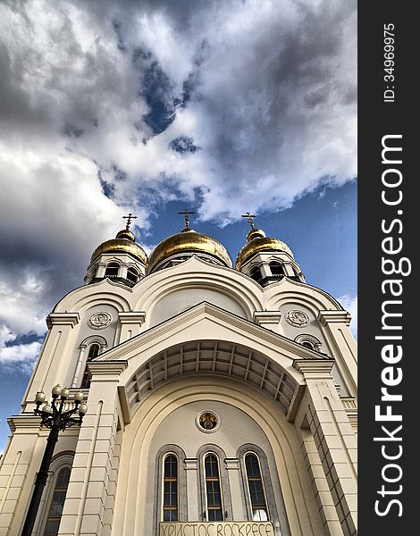 The orthodox temple in the light of a bright sun