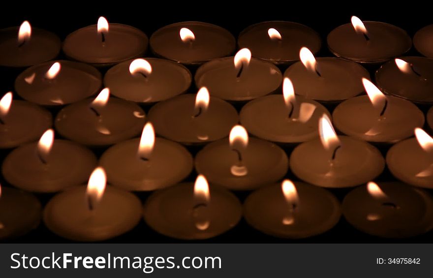 The flame of candles shivers on a wind. The candles blow and becomes darkly, except for one candle. Then and it dies away. The flame of candles shivers on a wind. The candles blow and becomes darkly, except for one candle. Then and it dies away