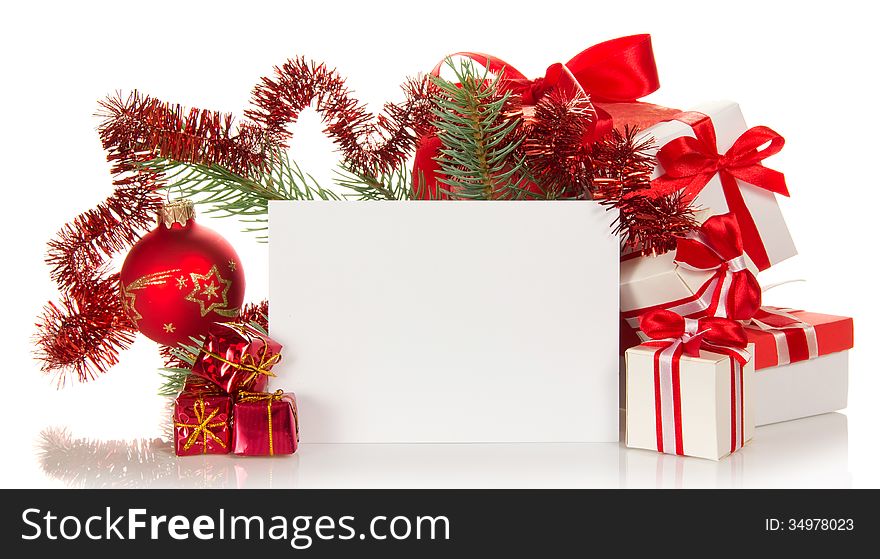 Set of the various gift boxes, the decorated branch of a fir-tree and empty card on white. Set of the various gift boxes, the decorated branch of a fir-tree and empty card on white
