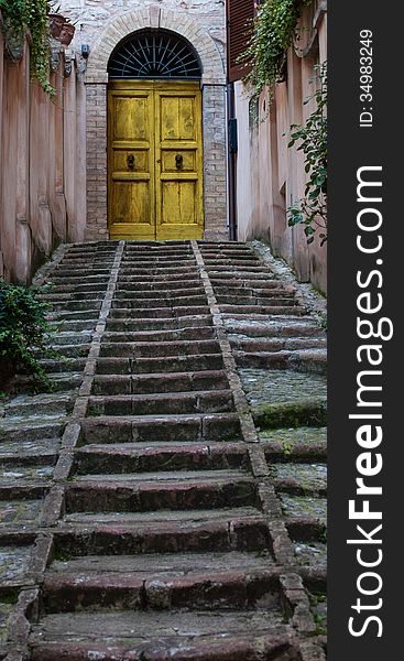 Traditional italian door in the medieval town. Traditional italian door in the medieval town.