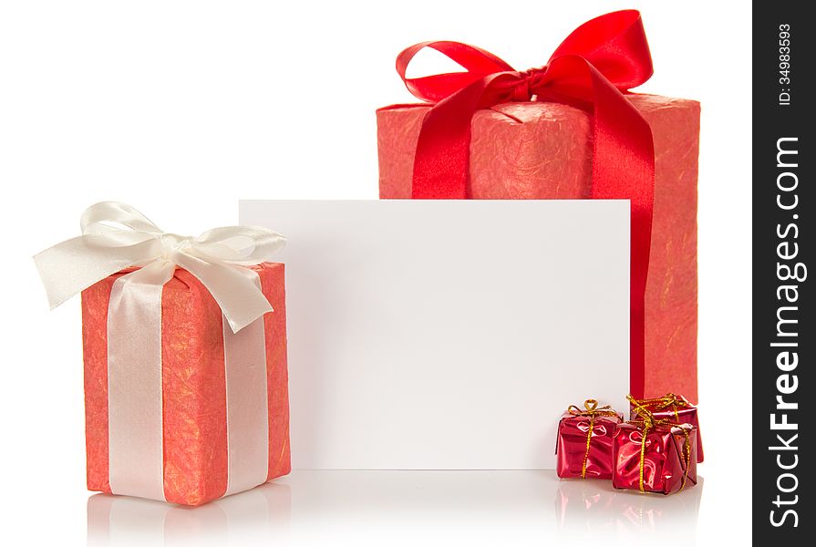 Set of different gift boxes and the empty card for messages isolated on white