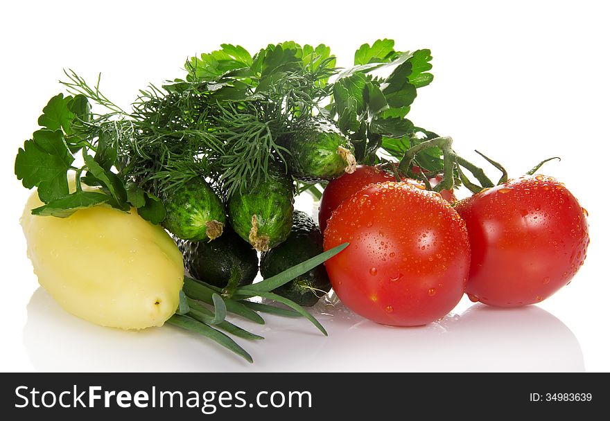 Tomatoes, cucumbers, pepper, parsley, dill and the onions isolated on white