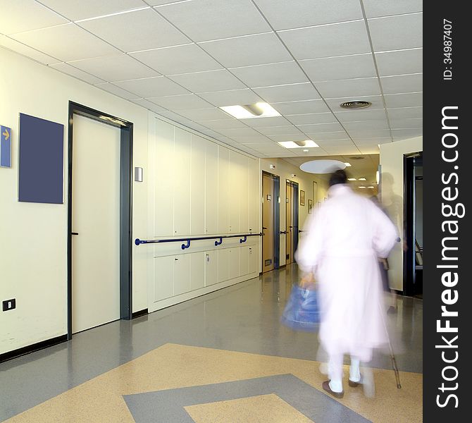 Hospital ward with a patient on move