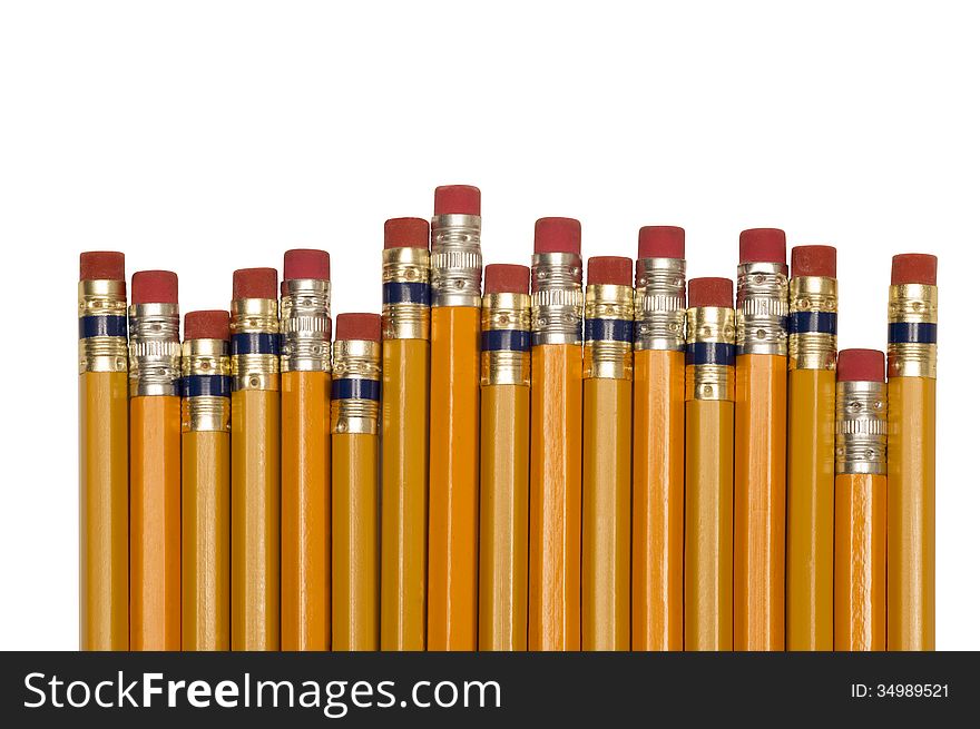 Group of yellow pencils shot close up horizontally in studio. On white background.