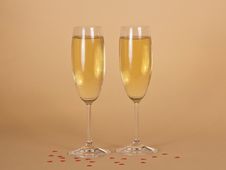 Two Wine Glasses Of Champagne And Small Hearts On Royalty Free Stock Images