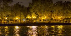 Sidewalk By Canal, Lit By Several Lamp Posts, And Small Pier Royalty Free Stock Images Sidewalk By Canal, Lit By Several Lamp Posts, And Small Pier Royalty Free Stock Images