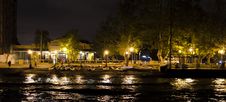 Parked Canoes By Canal, Along Sidewalk Lit By Lamp Posts Royalty Free Stock Photo