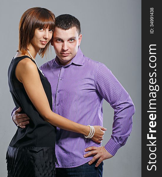 Man and women embracing in a studio shot. Man and women embracing in a studio shot