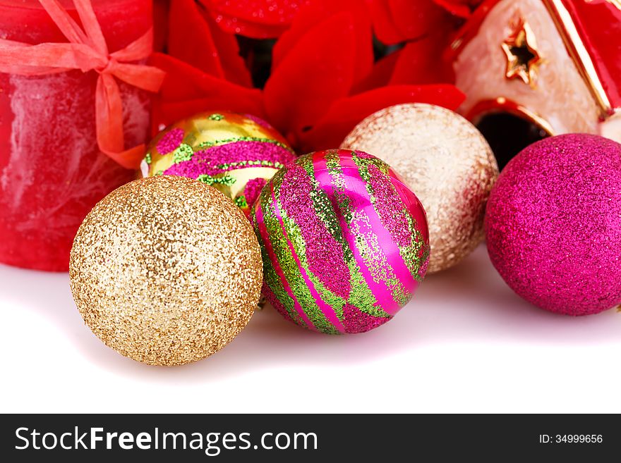 Christmas colorful balls with holly berry flowers and candle closeup image. Christmas colorful balls with holly berry flowers and candle closeup image.