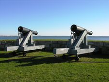 A Pair Of Cannons Facing The Sea. Stock Photography A Pair Of Cannons Facing The Sea. Stock Photography