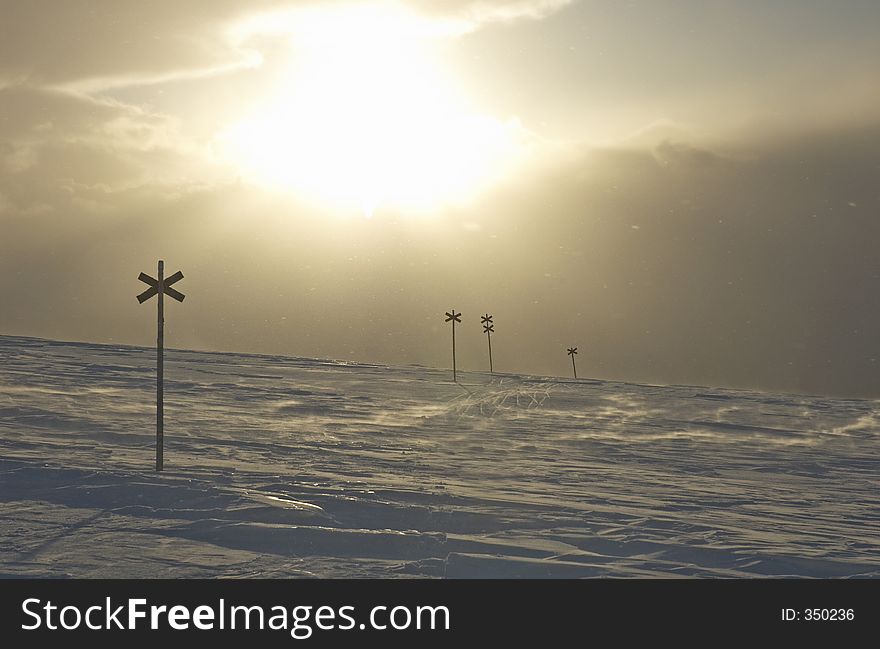 Crosses to sign the winter path on snowy mountains close to Valadalen, Jamtlands region, North Sweden. Crosses to sign the winter path on snowy mountains close to Valadalen, Jamtlands region, North Sweden