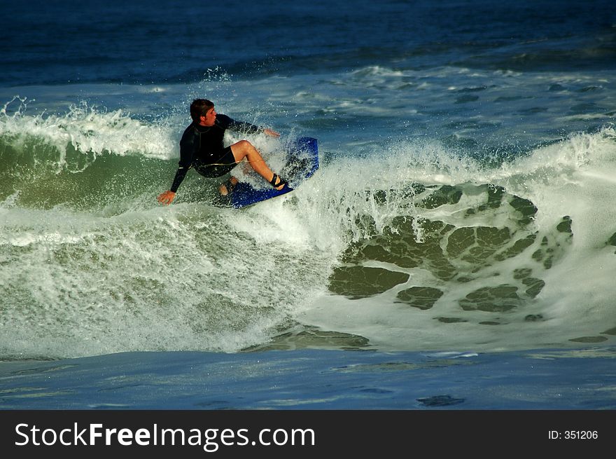 Bodyboarder ontop of a wave. Bodyboarder ontop of a wave