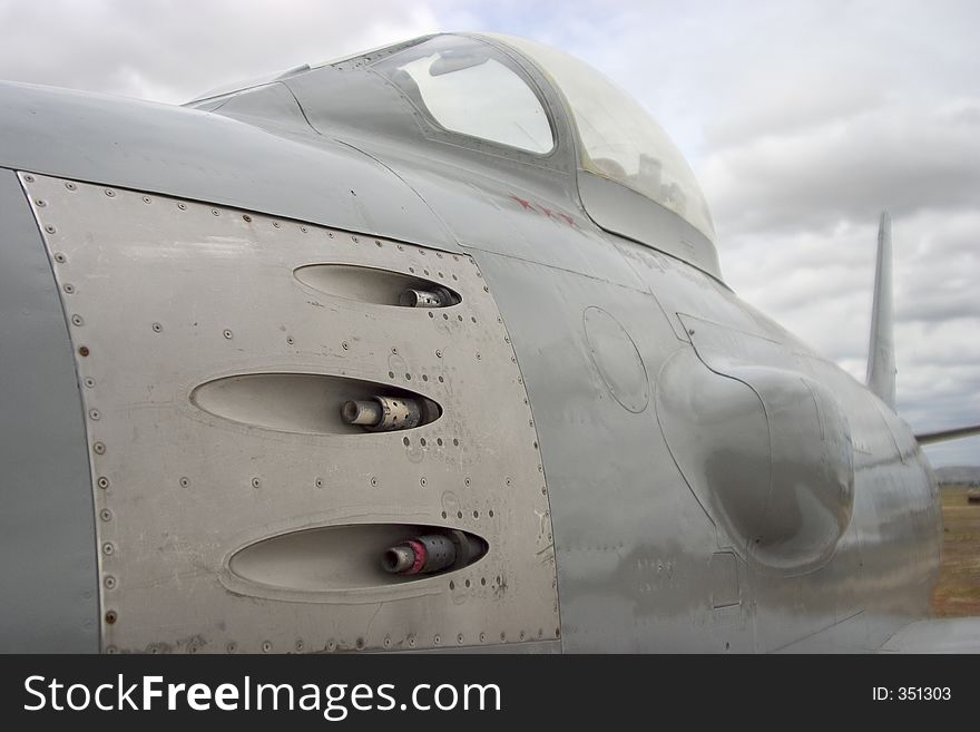 A jet fighter with some intimidating machine guns. A jet fighter with some intimidating machine guns.