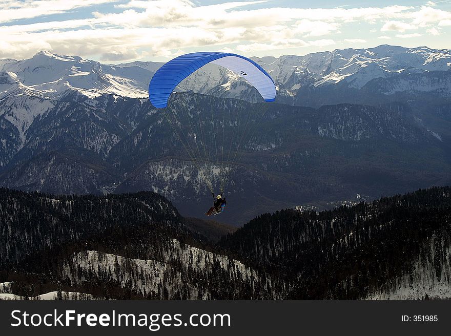 Paraglider in the mountains. Paraglider in the mountains