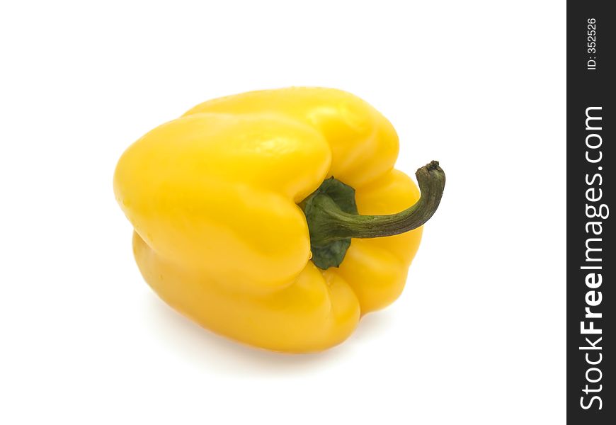 Yellow bulgarian pepper over the white. Yellow bulgarian pepper over the white