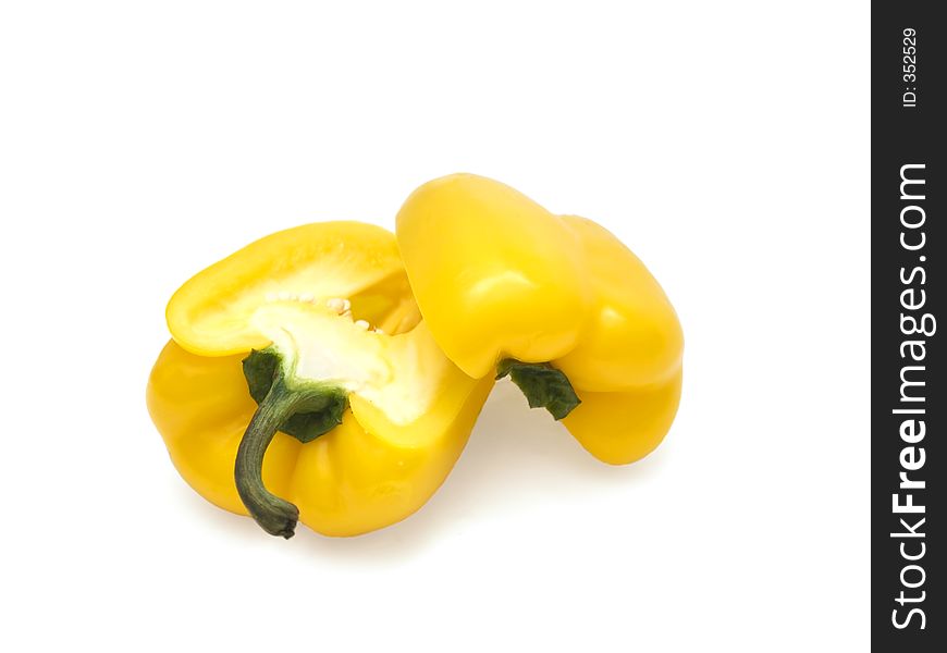 Two half of yellow bulgarian pepper over the white. Two half of yellow bulgarian pepper over the white