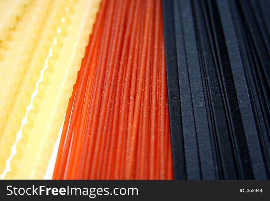 Background with three kinds and colors of pasta. Background with three kinds and colors of pasta