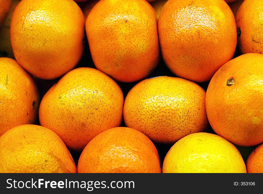 Medium shot of a Graphic layout of bright colored oranges