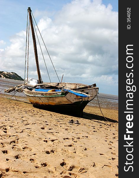 A boat stranded on the beach during low-tide in Bazaruto. A boat stranded on the beach during low-tide in Bazaruto