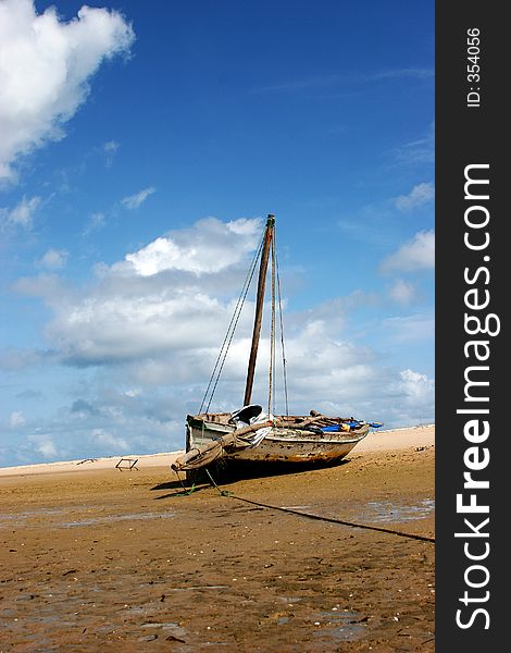 A boat stranded on the beach during low-tide in Bazaruto. A boat stranded on the beach during low-tide in Bazaruto