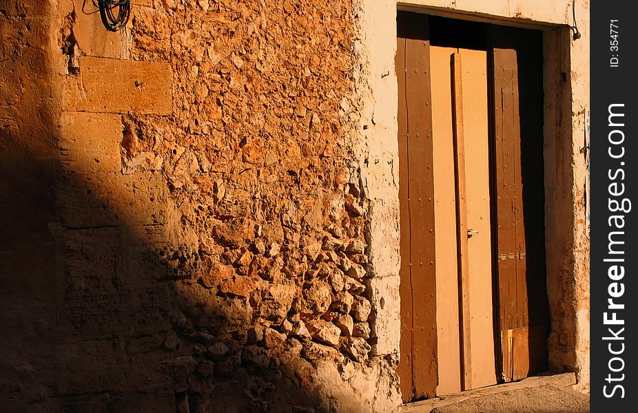 Old door of a spanish building in the afternoon sunlight. Old door of a spanish building in the afternoon sunlight