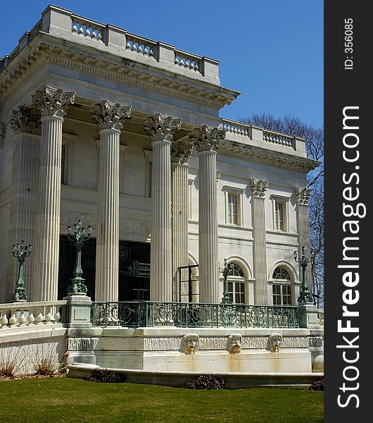 The front entrance of a large white mansion - Vertical Crop. The front entrance of a large white mansion - Vertical Crop