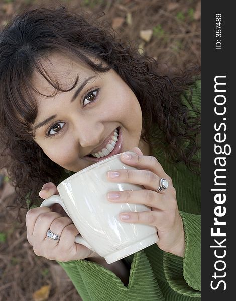 Smiling woman drinking