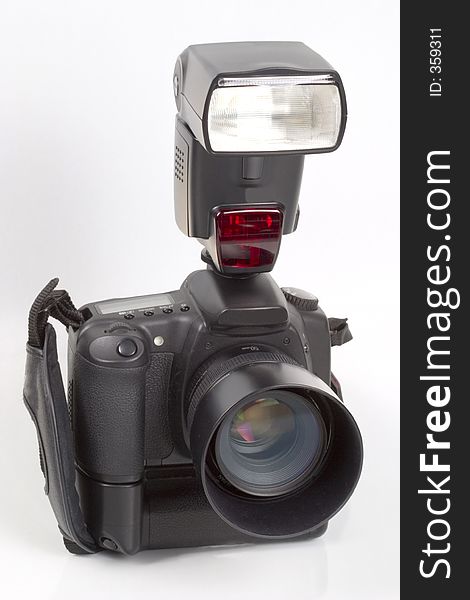A digital single lens reflex camera with mounted flashgun. A digital single lens reflex camera with mounted flashgun
