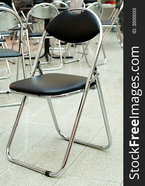Metal chair with black upholstery in